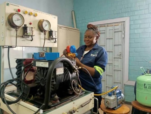 Trainee working on a refrigeration training station